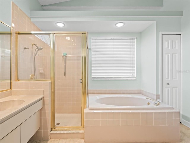 bathroom featuring vanity and shower with separate bathtub