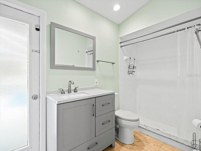 bathroom with vanity, tile patterned floors, toilet, and a shower with shower curtain