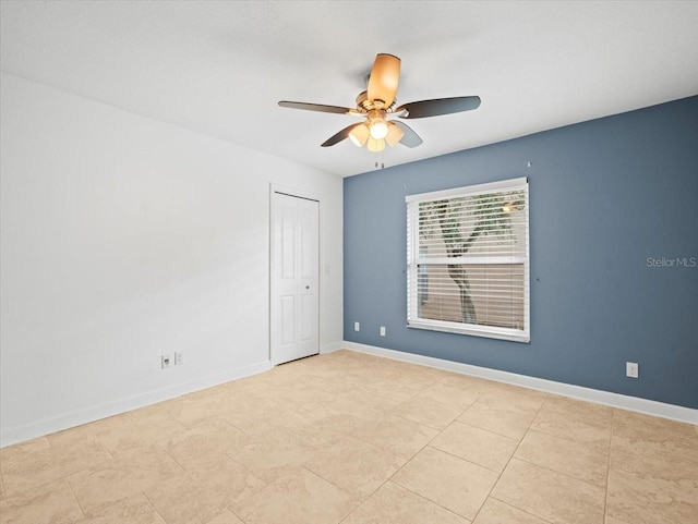 spare room with ceiling fan