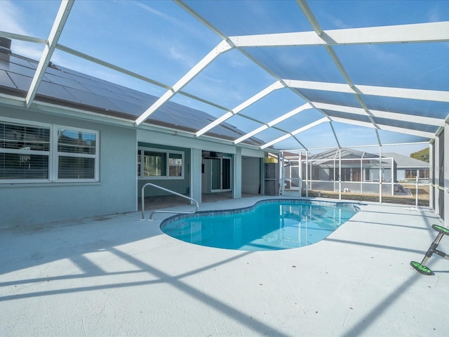 view of pool featuring a patio and glass enclosure