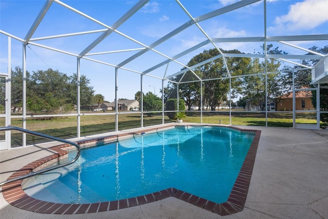 view of pool featuring a yard, a lanai, and a patio area