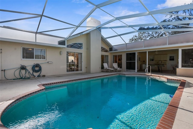 view of pool with a lanai and a patio area