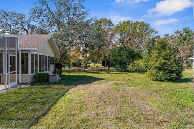 view of yard featuring a sunroom