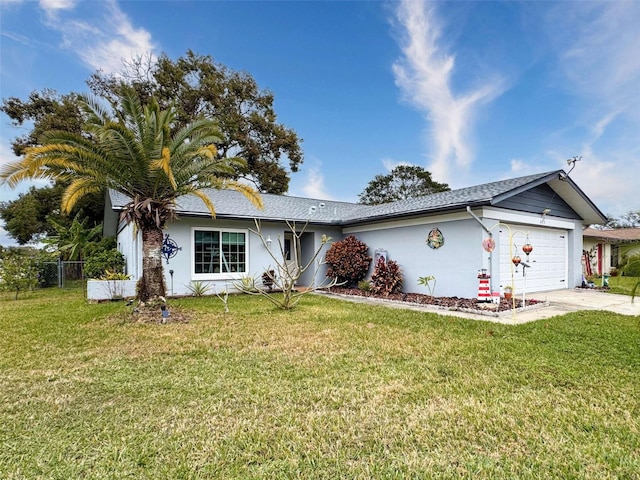 ranch-style home featuring a front yard and a garage