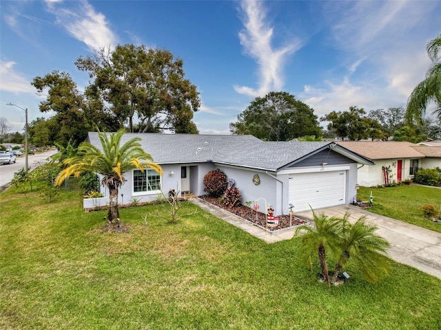 ranch-style home featuring a garage and a front yard