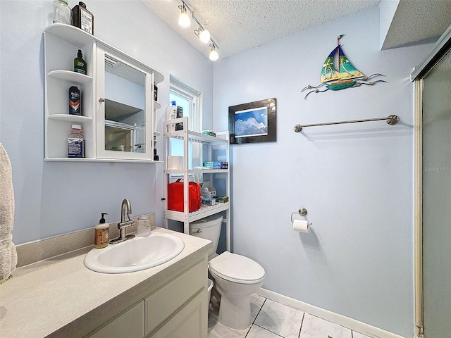 bathroom with vanity, a textured ceiling, toilet, and an enclosed shower