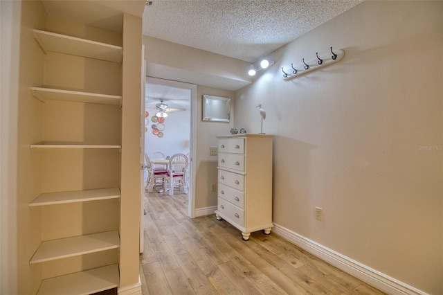 interior space featuring light hardwood / wood-style floors and ceiling fan