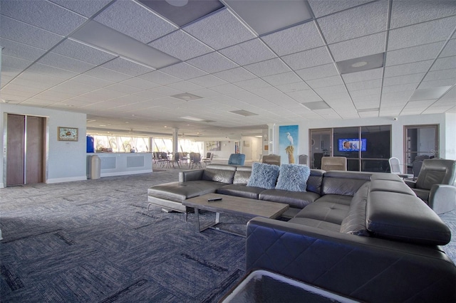 carpeted living room with elevator