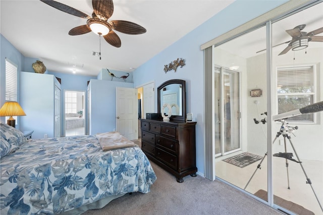 carpeted bedroom featuring ensuite bath and ceiling fan