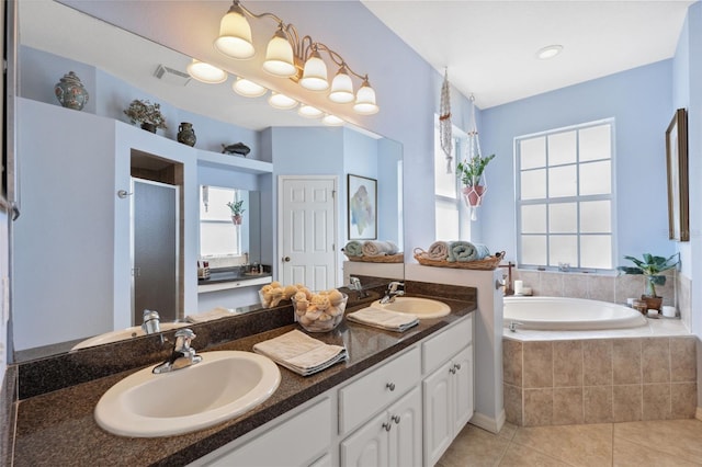 bathroom featuring vanity, tile patterned flooring, and independent shower and bath