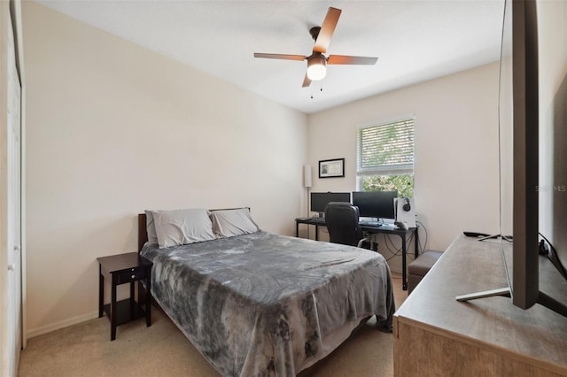 bedroom featuring ceiling fan and light colored carpet