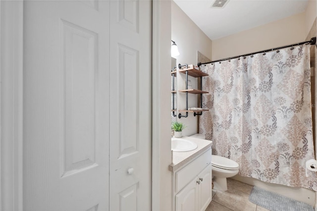 bathroom featuring toilet, tile patterned flooring, a shower with curtain, and vanity