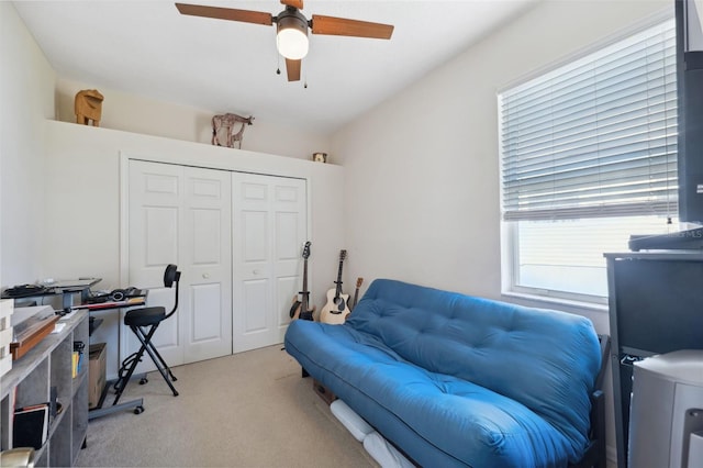 carpeted home office with ceiling fan