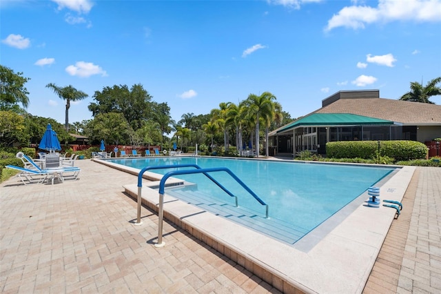 view of swimming pool featuring a patio area