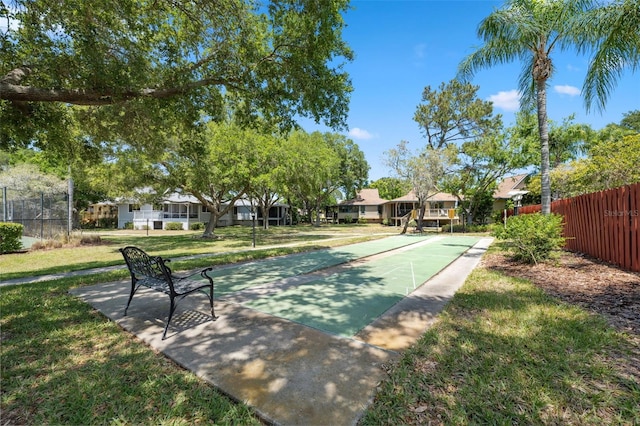 view of property's community featuring a lawn