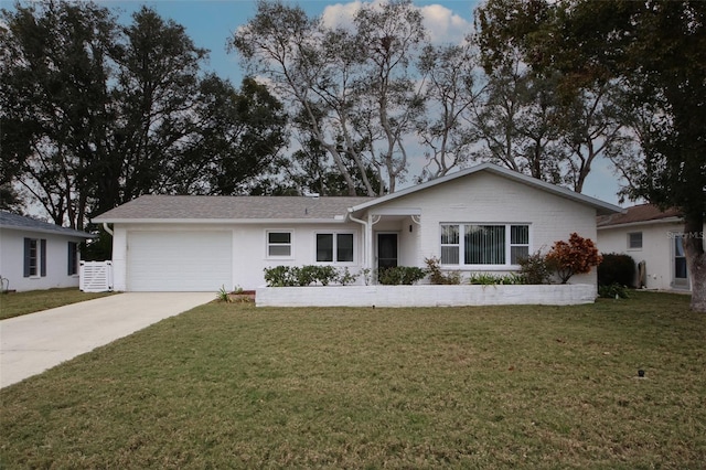 ranch-style house with a front yard and a garage