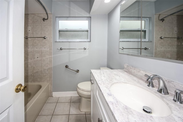 full bathroom with tile patterned flooring, vanity, toilet, and tiled shower / bath