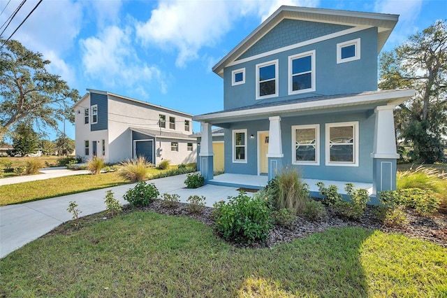 view of front of property featuring a porch and a front yard