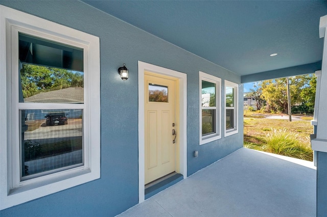 doorway to property with covered porch