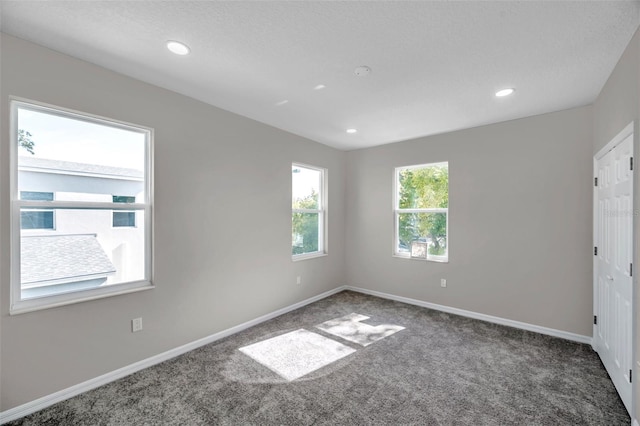 empty room with carpet flooring