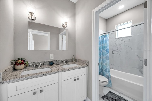 full bathroom with shower / tub combo, vanity, and toilet