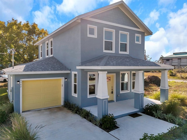 view of front of home featuring a porch and a garage