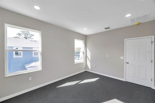 view of carpeted spare room