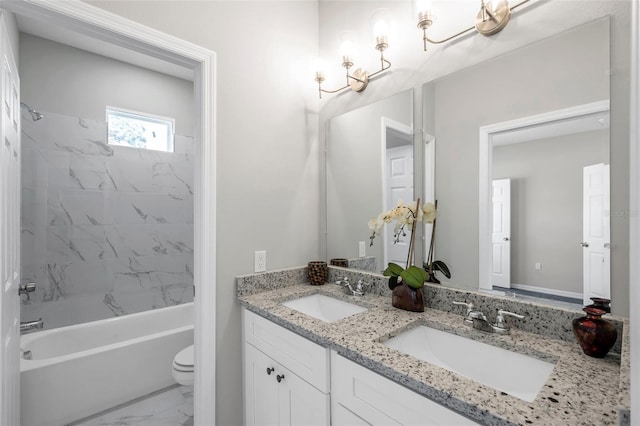 full bathroom featuring vanity, toilet, and tiled shower / bath