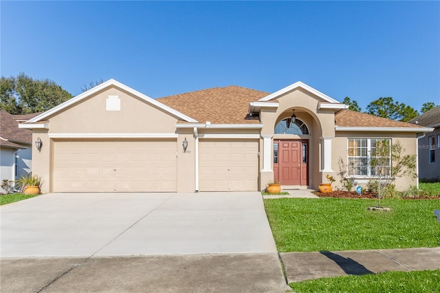 ranch-style house with a front lawn and a garage