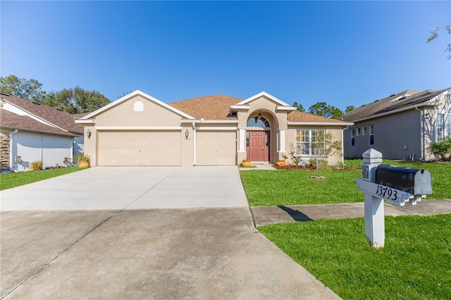 single story home featuring a garage and a front lawn