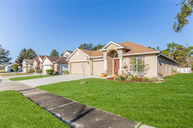 view of front facade featuring a front lawn and a garage