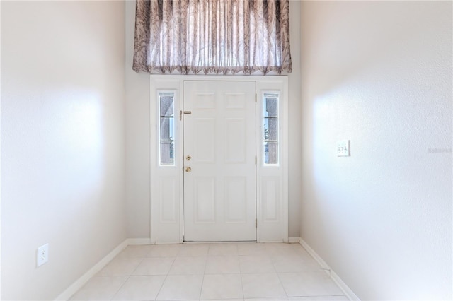 foyer with light tile patterned flooring