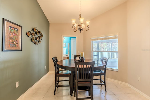 tiled dining space with vaulted ceiling and an inviting chandelier