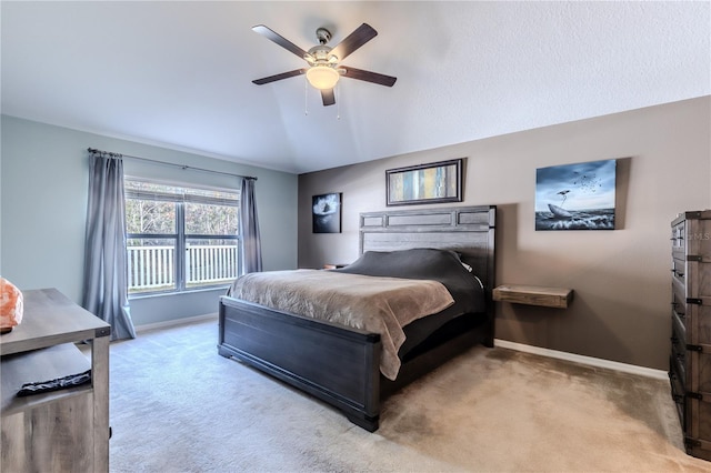 bedroom with light carpet, ceiling fan, and vaulted ceiling