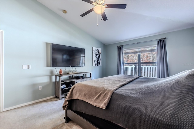 bedroom with ceiling fan, light colored carpet, and vaulted ceiling