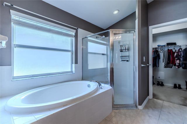 bathroom featuring vaulted ceiling, tile patterned floors, and separate shower and tub