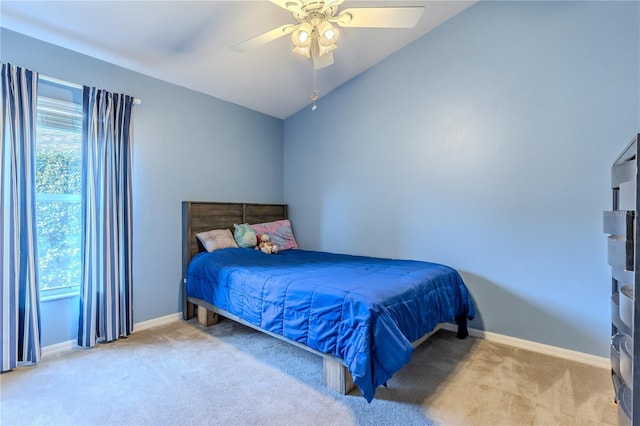 bedroom featuring ceiling fan, carpet floors, and lofted ceiling