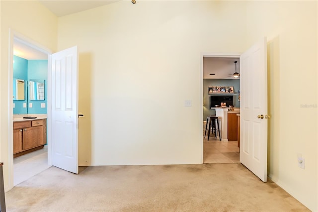 carpeted empty room with ceiling fan