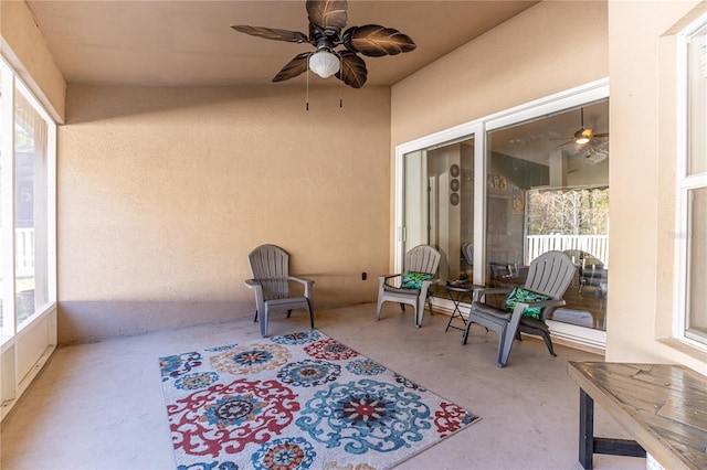 sunroom / solarium with ceiling fan and a wealth of natural light