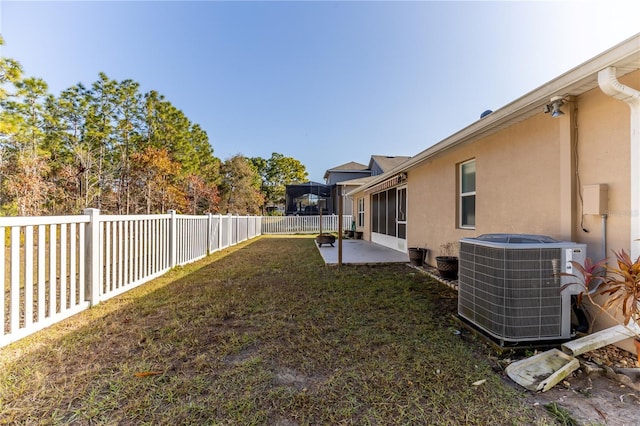 view of yard with a patio area and central air condition unit