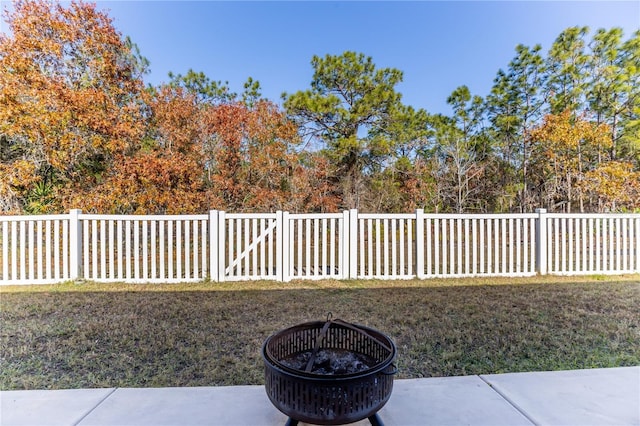 view of yard with an outdoor fire pit