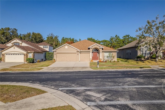 view of front facade featuring a front lawn and a garage