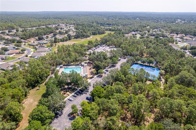 13793 Dunwoody Dr, Spring Hill, FL 34609 - bird's eye view of a pool and a forest