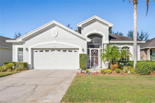 ranch-style home with a front yard and a garage