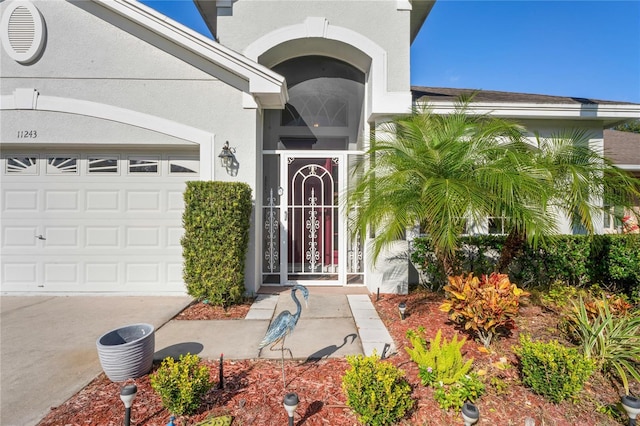 view of exterior entry featuring a garage