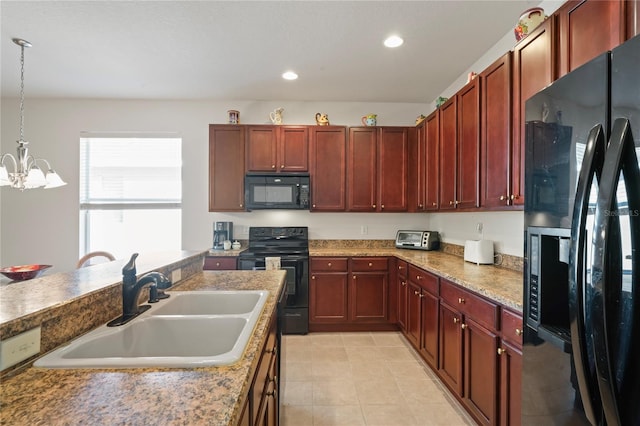 kitchen featuring sink, hanging light fixtures, black appliances, and a chandelier