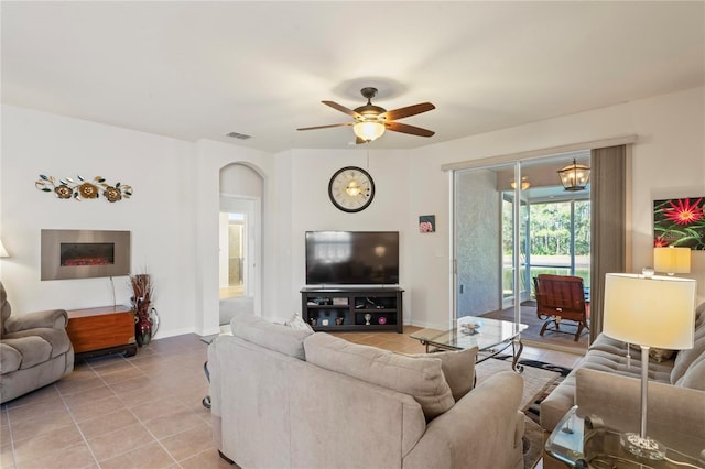 living room with ceiling fan and light tile patterned floors