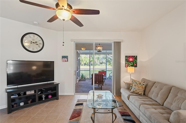 tiled living room featuring ceiling fan