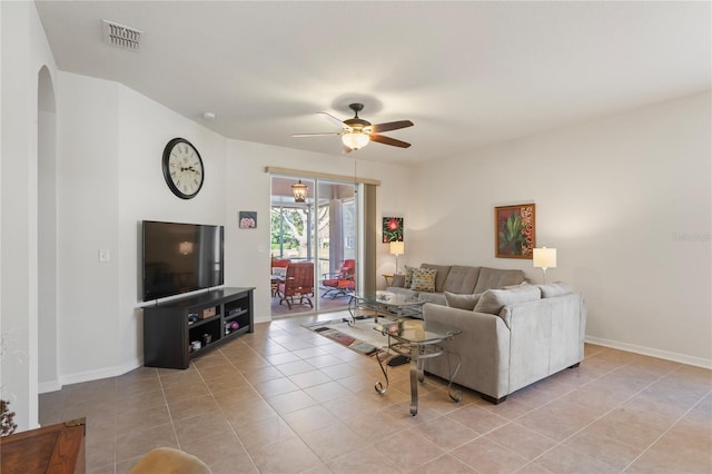 tiled living room featuring ceiling fan