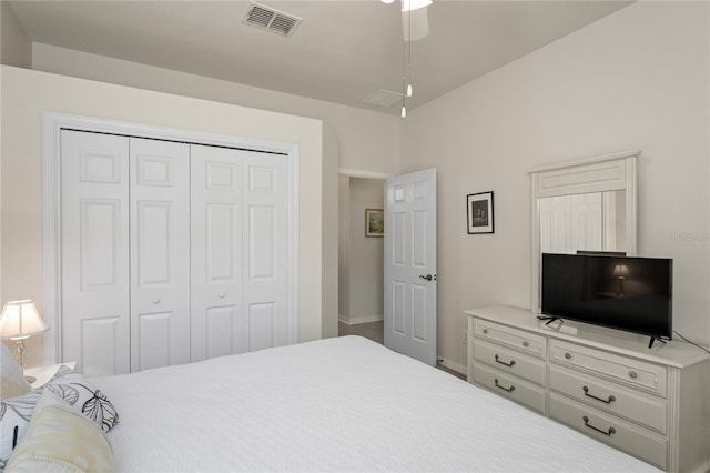 bedroom with ceiling fan and a closet